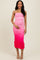 woman wearing a pink ombre midi dress with ruching and thin straps, posing and holding her hand on her waist