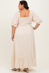 woman wearing a floral plus size maxi dress with puff sleeves and a smocked waist, shown from the back