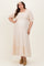 woman wearing a floral print maternity plus maxi dress with puff sleeves and a square neckline