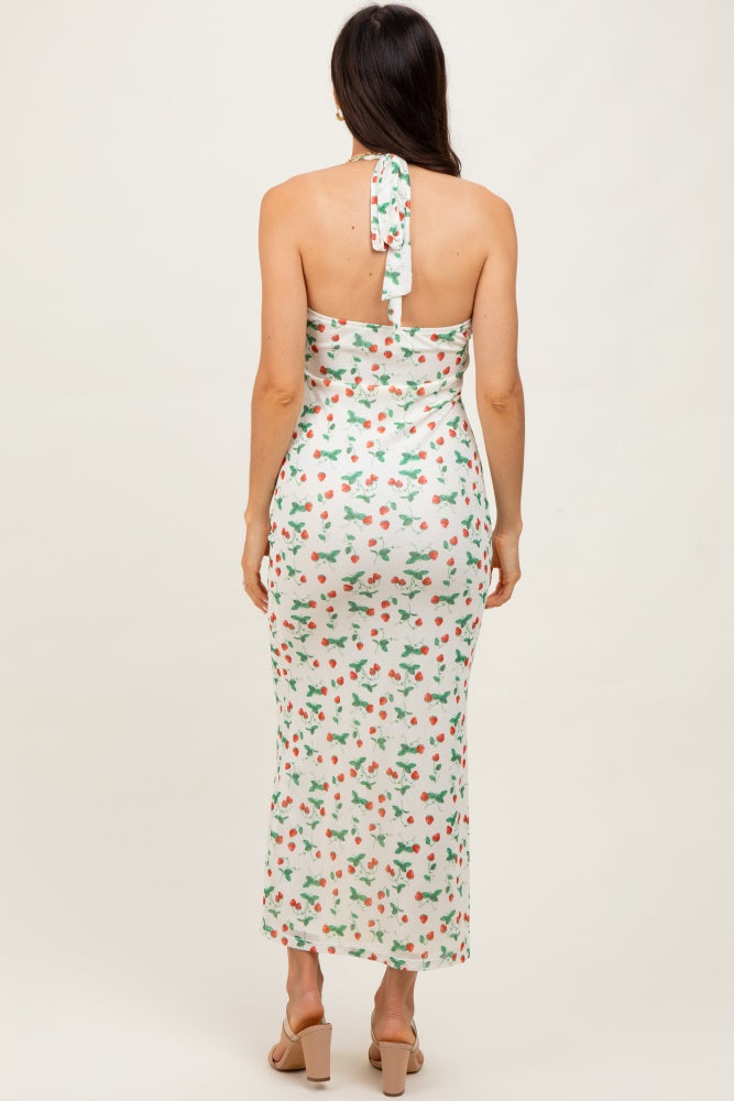 woman wearing a white floral tie-back midi dress with a fitted silhouette and a flowy hem