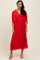 woman wearing a red pleated midi dress with a v-neck and cape sleeves