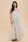 woman wearing a floral print maxi dress with a sweetheart neckline and thin straps