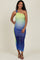 woman wearing a one-shoulder ombre maternity dress in green and blue, showcasing her baby bump
