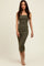 woman wearing an olive green fitted midi dress with a square neckline and side slit, styled with nude heels