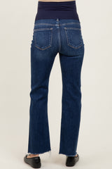 woman wearing dark blue maternity jeans with a stretchy waistband, showing the back view and frayed hem detail