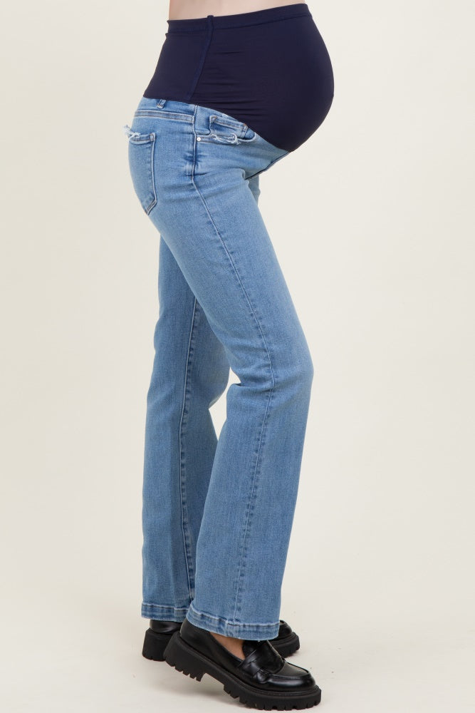 maternity wear blue bootcut jeans with a stretchy black belly panel, model showing baby bump