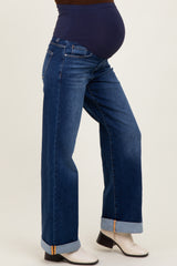woman wearing a pair of dark blue maternity wide-leg jeans with a comfortable belly panel and cuffed hems