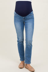 woman wearing light blue maternity jeans with a dark blue over-the-belly panel