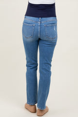 woman wearing light blue maternity jeans with a navy belly panel, shown from the back