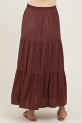 maternity wear brown tiered maxi skirt with an elastic waistband, model shown from the back