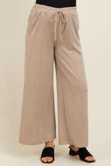 woman wearing light gray wide-leg maternity pants with an elastic waistband and drawstring detail