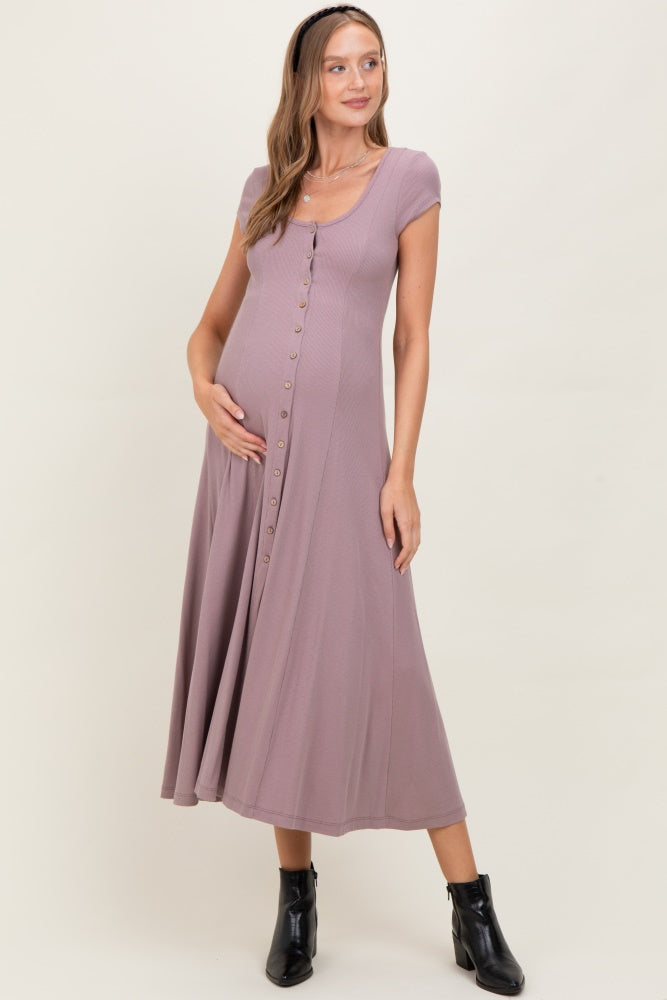 woman wearing a lavender button-front maxi maternity dress and showcasing her baby bump