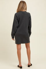 woman wearing a dark gray long sleeve maternity dress, viewed from the back