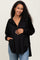 woman wearing a black maternity hoodie with a front pocket and button details, gently cradling her baby bump