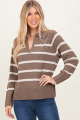 woman wearing a brown and cream striped pullover sweater with a v-neck and long sleeves