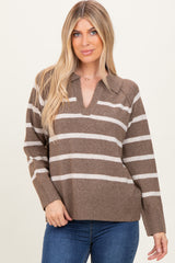 woman wearing a brown and cream striped long sleeve sweater with a collar and relaxed fit while smiling at the camera