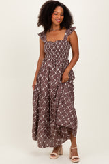 woman wearing a brown floral maxi dress with ruffled straps and smocked bodice