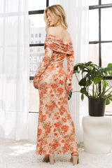 woman wearing a floral off-the-shoulder maxi dress with long sleeves, standing in front of a window