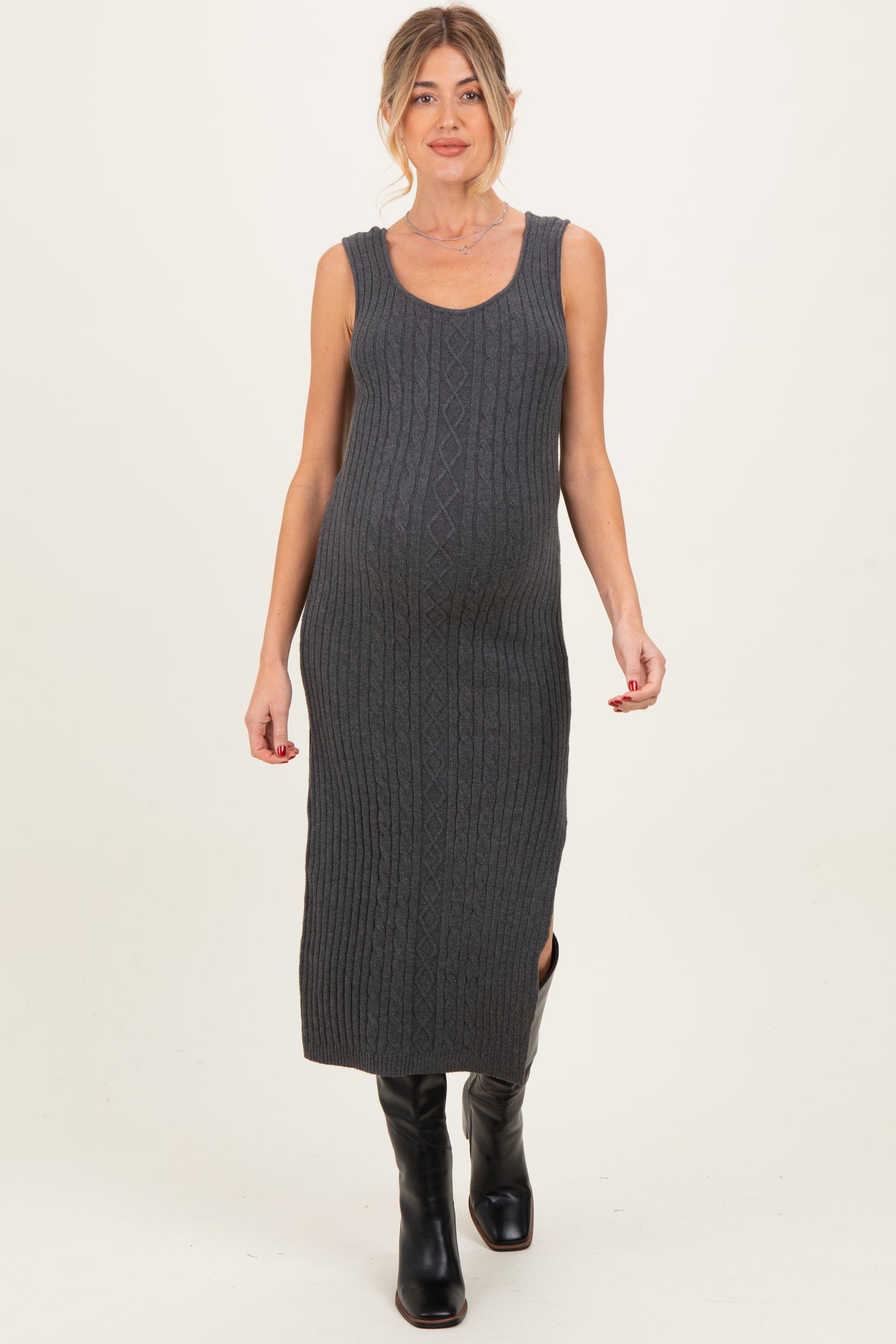 woman wearing a gray ribbed maternity dress with a fitted silhouette and side slit, highlighting her baby bump