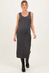 woman wearing a gray ribbed maternity dress with a fitted silhouette and side slit, highlighting her baby bump