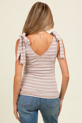 woman wearing a striped maternity tank top with bow tie details on the shoulders, showing her back