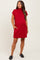 woman wearing a red short sleeve maternity dress with pockets and a relaxed fit, showing a visible baby bump