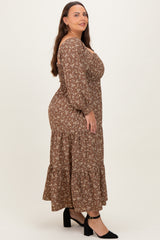 plus size woman wearing a brown floral maxi dress with puff sleeves and a tiered skirt