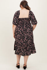 maternity wear black floral print midi dress with puff sleeves and a ruffled hem, model shown from the back