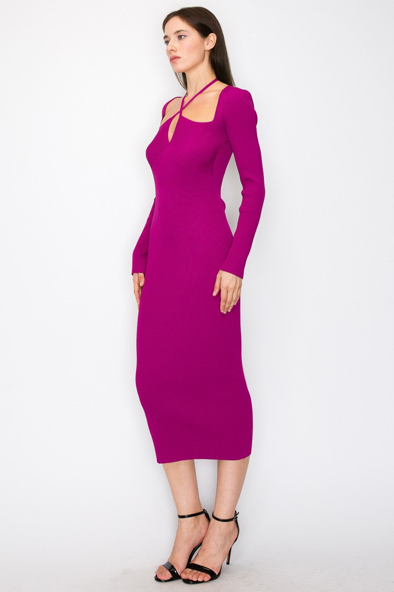 woman wearing a fuchsia ribbed midi dress with long sleeves and cut-out detail on shoulders