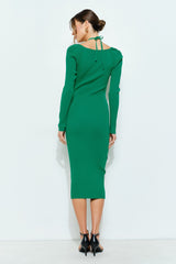 woman wearing a green ribbed long sleeve midi dress with a tie back detail