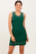 woman wearing a green ribbed sleeveless dress with silver trim details
