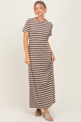 woman wearing a brown and white striped maxi dress with short sleeves and a relaxed fit