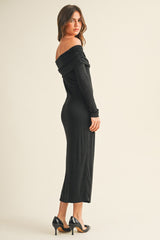 woman wearing a black off-shoulder long sleeve fitted dress with a midi length and high heels
