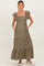 woman wearing a floral print green maternity maxi dress with ruffle sleeves and pockets, standing against a neutral background