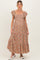 woman wearing a floral print maternity maxi dress with ruffle sleeves and a smocked bodice, showcasing her baby bump