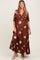 woman wearing a brown floral print maternity maxi dress with a tie detail and a visible baby bump