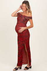 woman wearing a red floral off-the-shoulder maternity gown with a side slit and holding her baby bump