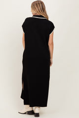 woman wearing a black maxi dress with short sleeves and slits on the side, shown from the back