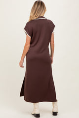 woman wearing a brown maternity maxi dress with short sleeves and side slits, model seen from the back