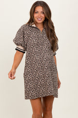 woman wearing a leopard print oversized polo dress with short sleeves and a relaxed fit, showing her baby bump