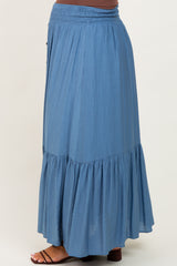 maternity wear flowy blue maxi skirt with a tiered design and smocked waist, model shown from the side