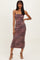 woman wearing a burgundy and brown tie-dye ruched midi dress with spaghetti straps and a fitted silhouette