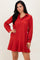 woman wearing a red striped long sleeve dress with a button-up collar and flared hemline