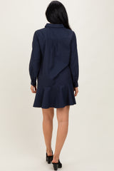 woman wearing a navy blue striped long sleeve shirt dress with a flared hem and back yoke detail