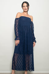 woman wearing a navy blue off-the-shoulder lace maxi dress with long sheer sleeves and a flowy silhouette