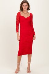woman wearing a red long sleeve bodycon dress with ruched detailing and lace sleeves