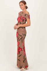 woman wearing a beige off-shoulder gown with red floral prints and a fitted silhouette