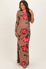 woman wearing a long sleeve beige floral maternity dress with red roses and a fitted silhouette