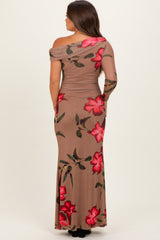 woman wearing a brown floral maternity dress with one shoulder exposed and a fitted silhouette