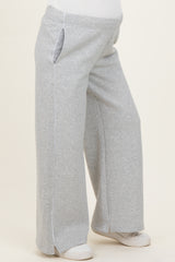 woman wearing gray maternity sweatpants with side pockets and a relaxed fit